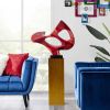 Metallic red abstract mask floor sculpture w/ wood stand, 54" tall